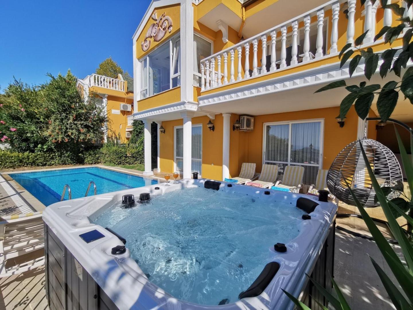 With A Pool And Jacuzzi